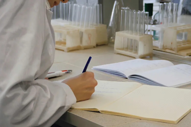 scientist taking notes