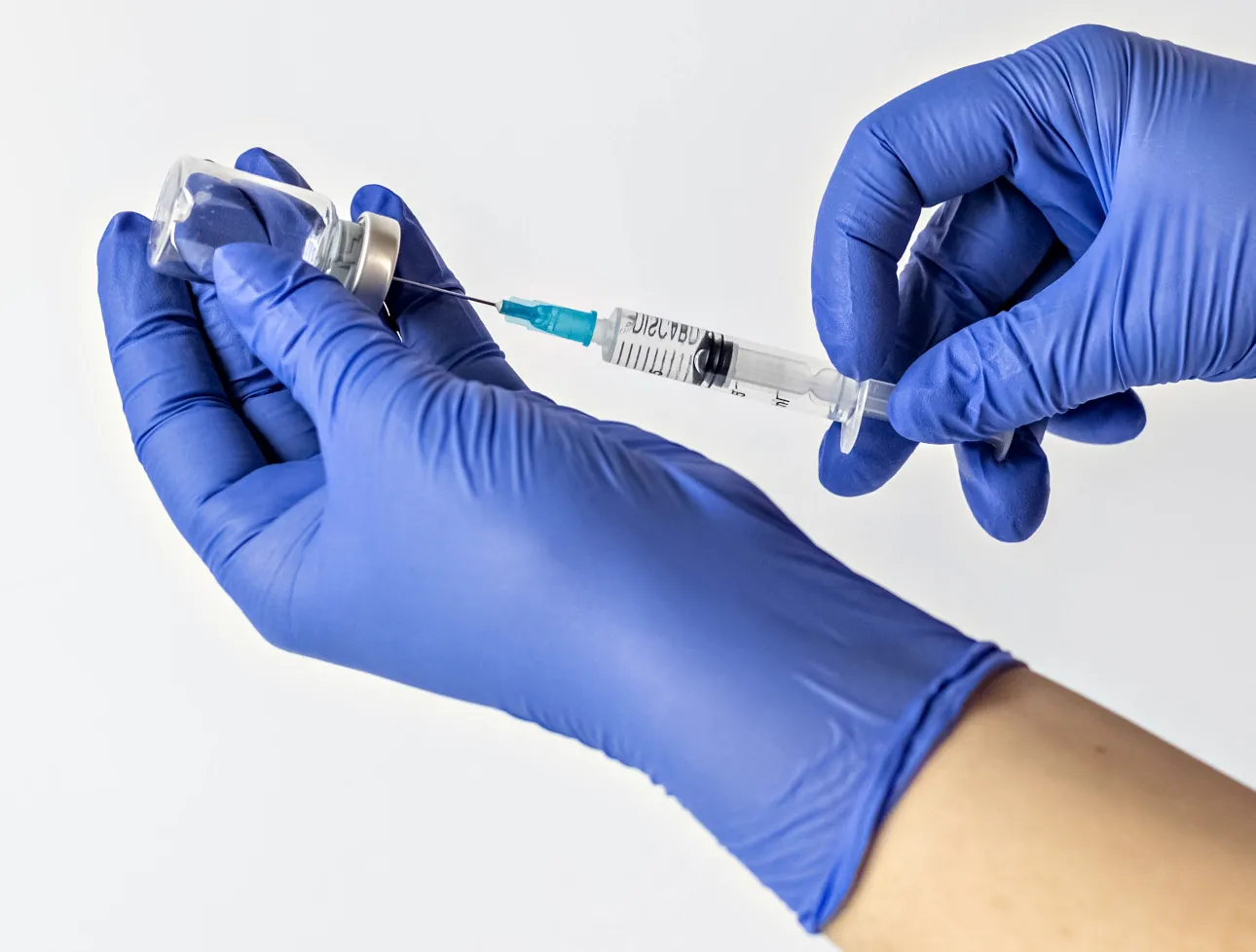 preparing needle for injection